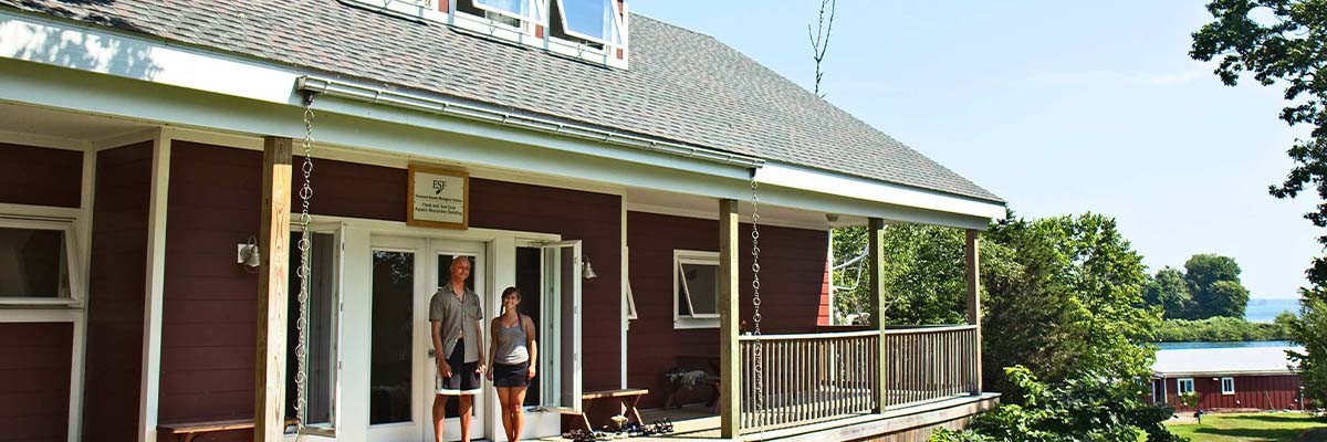 Two people on the TIBS building porch