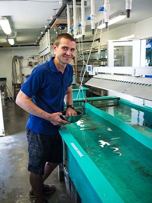Dr. John Paul tends to young muskellunge