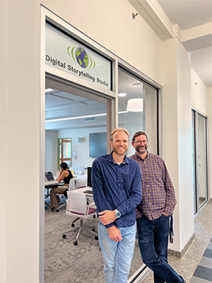 Tyler Dorholt and Jason Kohlbrenner standing in front of Digital Storytelling Studio