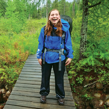 Cuddihy carrying a backpack