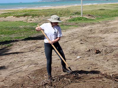 Lindsay Eberhart working in the field
