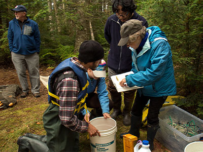Dr. Limburg working with students during field trip