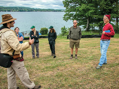 Sam Quinn explains to landowners Dan Fisher and Birney Imes. Also pictured are Brandy Neveldine ’09, Jess Proctor, Beth Imes and Lori Ruhlman.