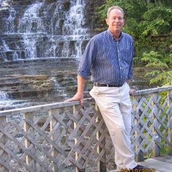 John Bartow infront of a waterfall