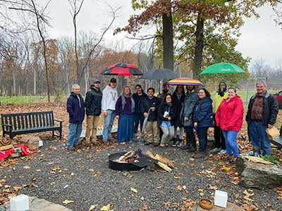 Sloan Cohort at firepit and healing space