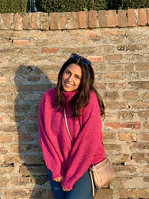 Kalyani Mer in a pink sweater