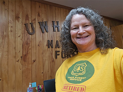 Theresa Savery wearing a US Forest Service retired tshirt