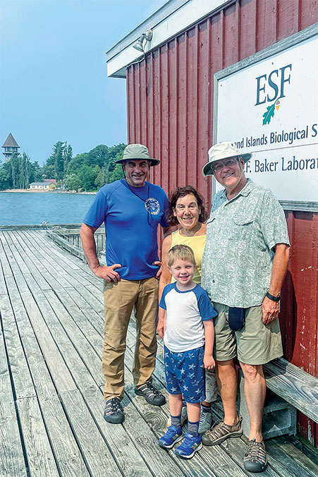 Nels and Debroh Magnuson wit their grandson and Dr.John Farrell at T I B S