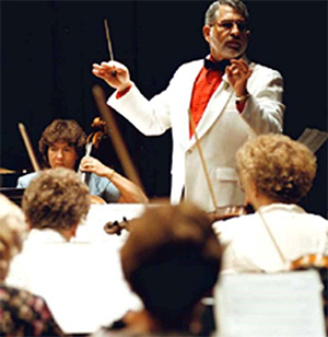 John Radosta conducting an orchestra