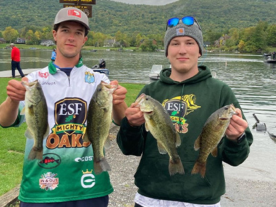 Bass fishing team members holding fish