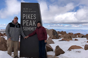 Scott Tait with a woman at Pikes Peak Summit