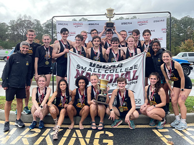 ESF Cross country team with their USCAA trophy